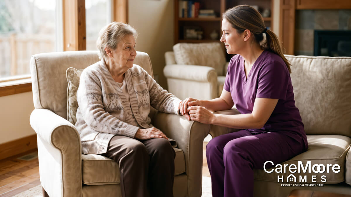 Caregiver holding hands with a senior woman in assisted living.