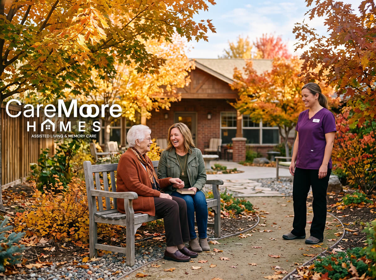Happy women sitting in an autumn garden at CareMoore Homes.